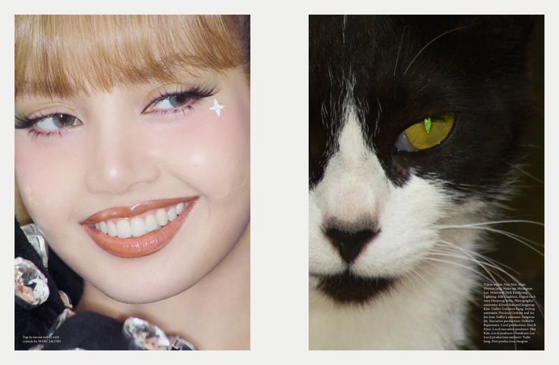 Beauty shot of a woman with light brown hair and a cat with black and white fur on a light beige background in a studio setting.