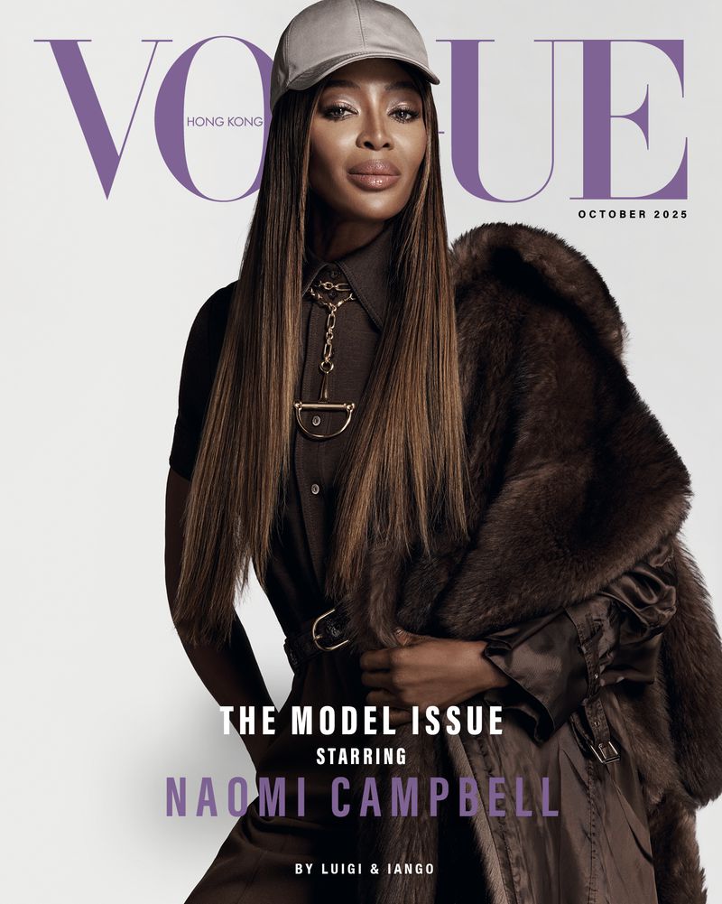 Vogue Hong Kong cover October 2025 featuring Naomi Campbell wearing a brown collared shirt, fur coat, chain necklace, and baseball cap against a white backdrop.
