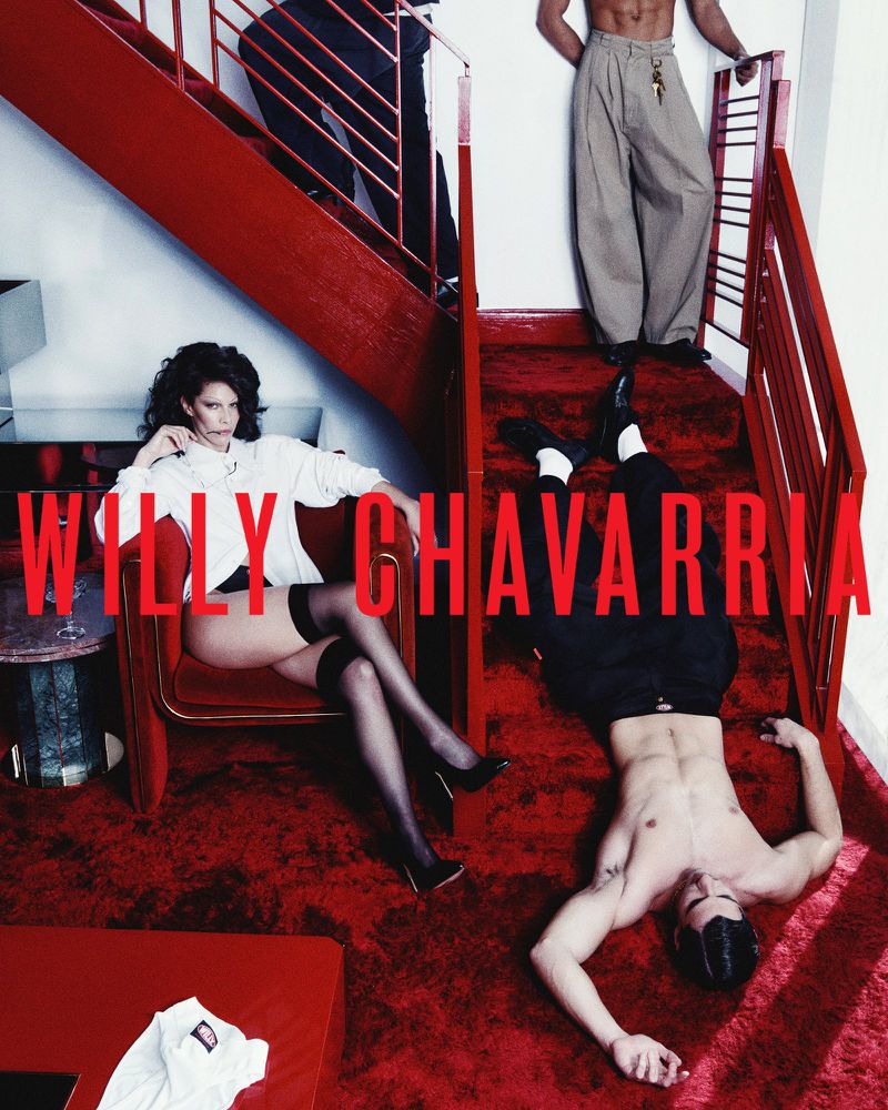 Fashion editorial: woman in chair, men on stairs, red carpet, and 'Willy Chavarria' text for brand promotion.  