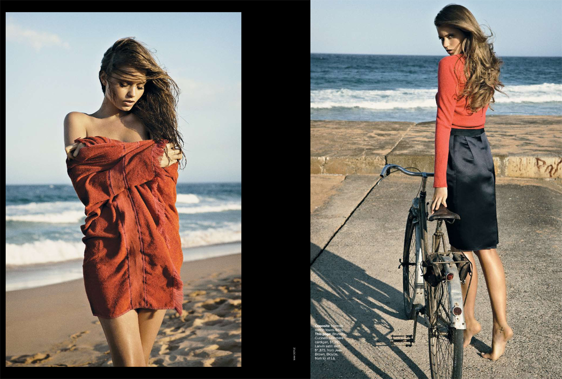 Fashion editorial shot of a woman in a red wrap on a beach, contrasted with a woman in a red top and skirt with a bicycle.