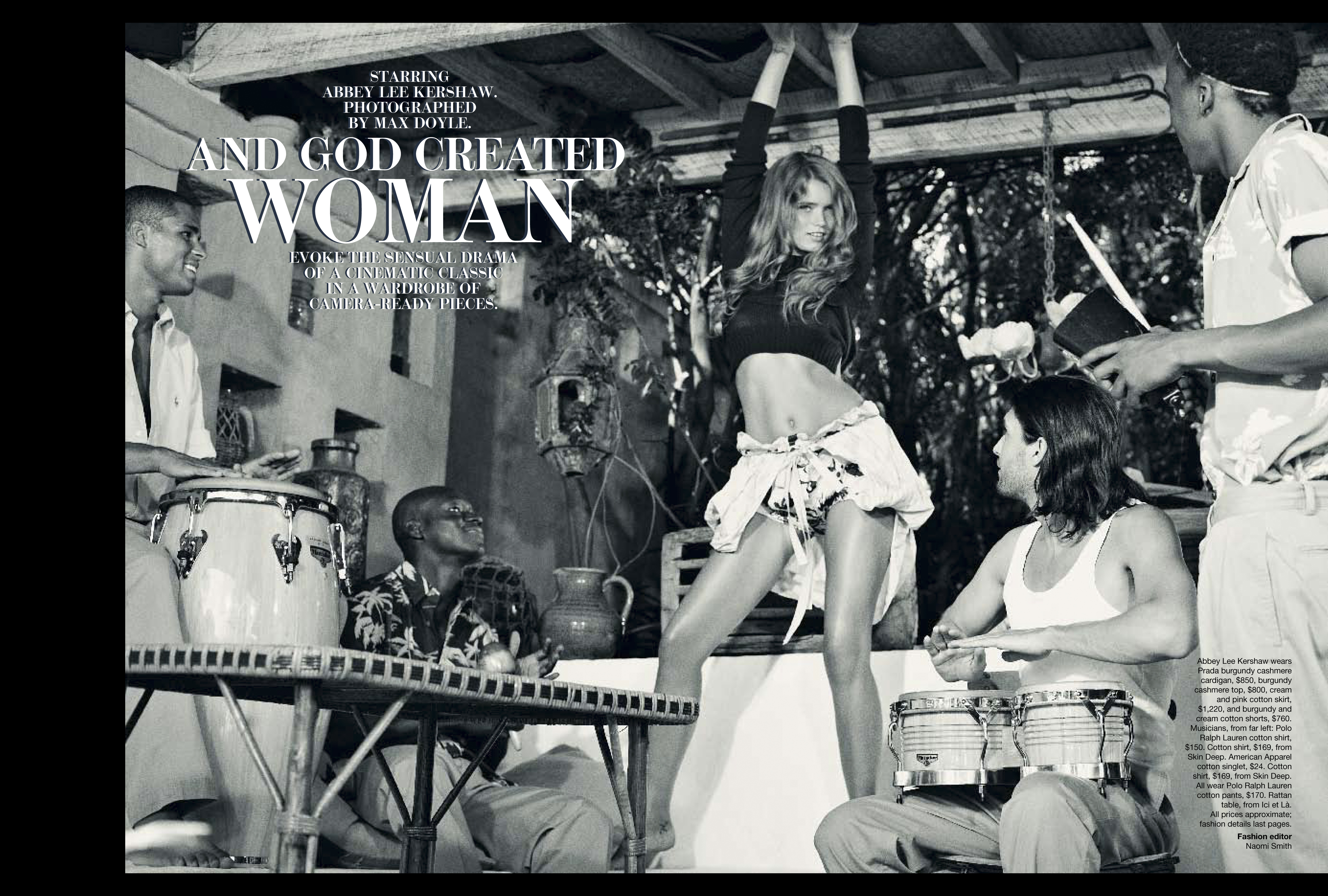 Monochrome fashion editorial shot with four people playing percussion instruments and a woman dancing with her arms raised.
