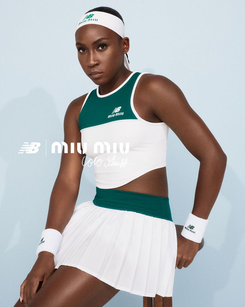 Female athlete in tennis outfit poses in photo studio with New Balance and Miu Miu branding, showcasing sporty fashion apparel.