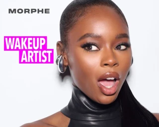 Close-up portrait of a Black woman with a surprised expression, wearing glossy makeup and silver earrings against a white background