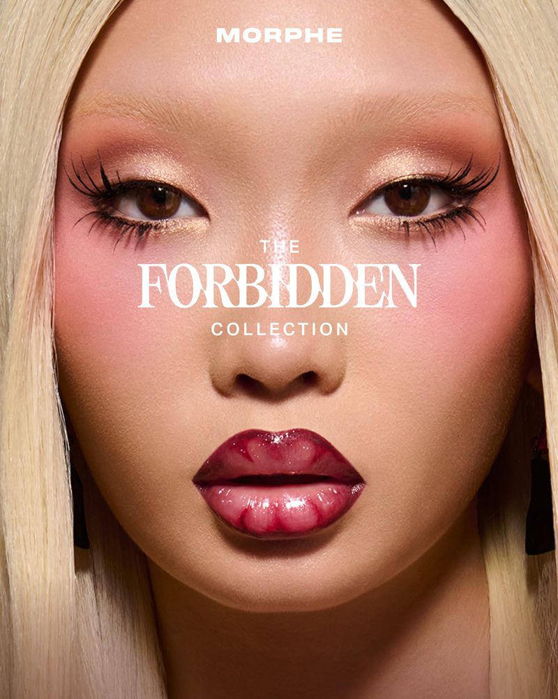 Close-up beauty shot of a female model with striking eye makeup, glossy lips, and blonde hair, showcasing Morphe's Forbidden Collection.