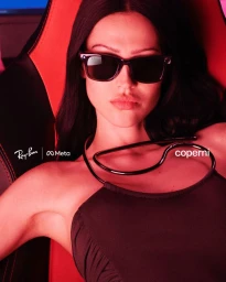 Model Amelia Gray wearing Ray-Ban Meta smart glasses and Coperni apparel in a red-lit setting.